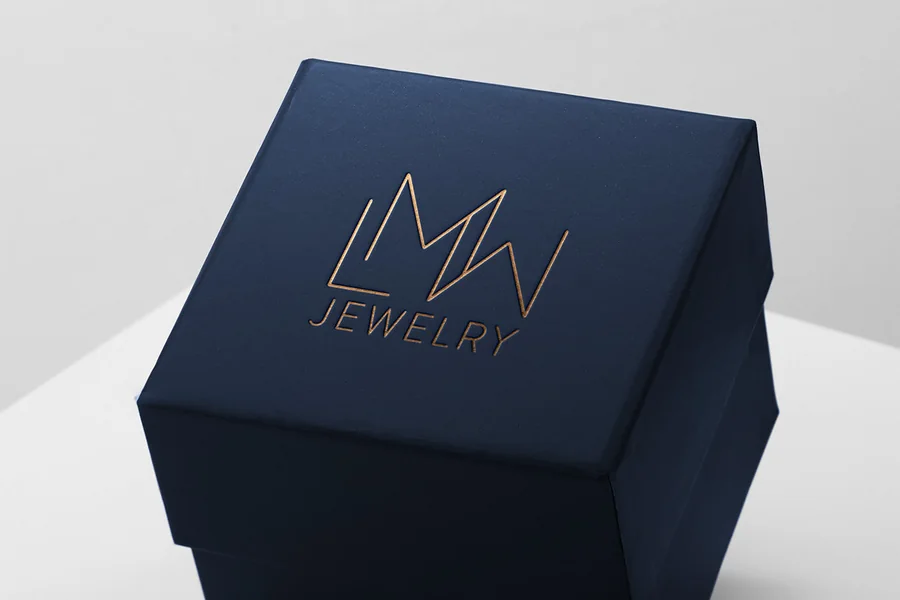 Navy jewelry box with gold foil logo mark designed by Blonnie Brooks
